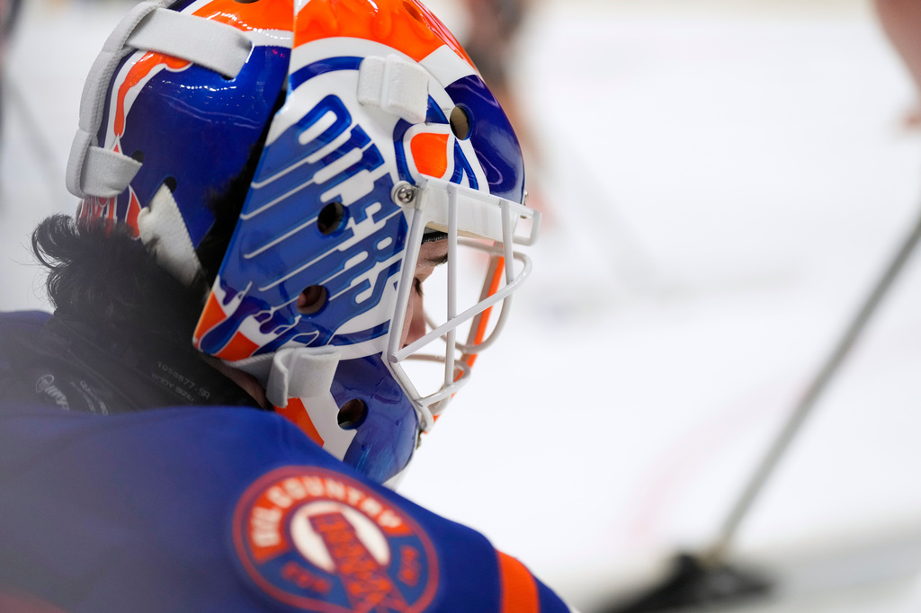 Edmonton Oilers goaltender Devon Levi takes a break during a timeout in the second period of an NHL hockey game against the Anaheim Ducks, Wednesday, Oct. 7, 2026, in Anaheim, Calif. (AP Photo/Mark J. Terrill)