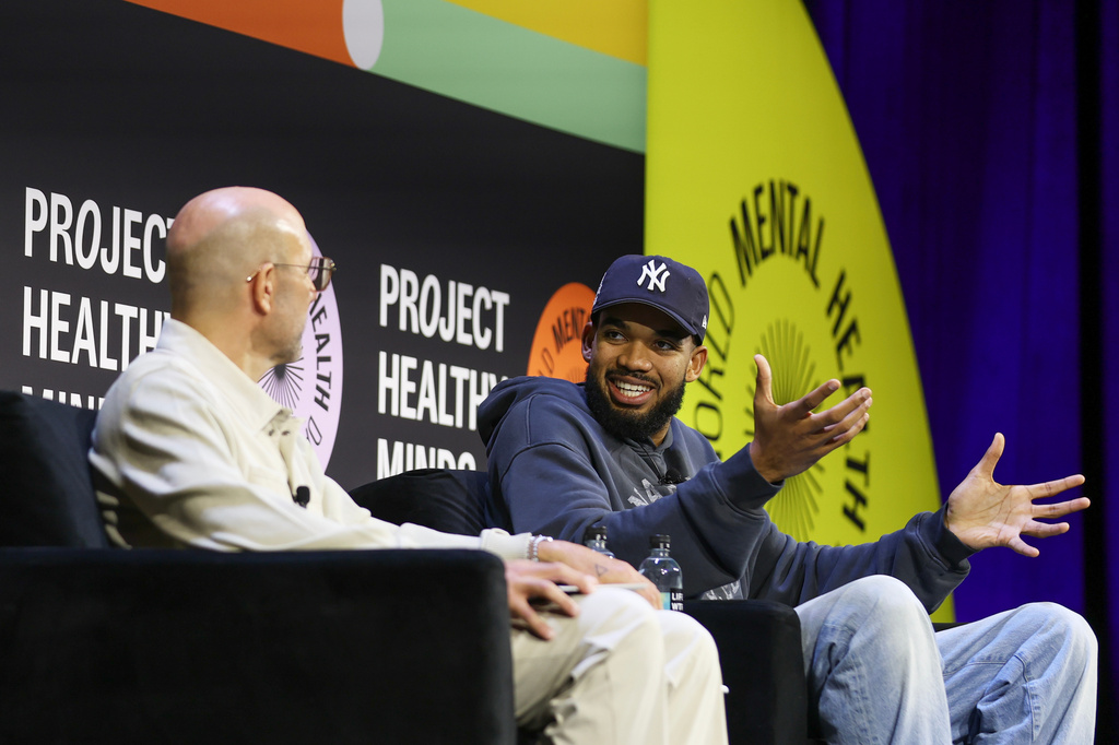 NBA player Karl-Anthony Towns of the New York Knicks sits for a discussion with Rich Kleiman at the Project Healthy Minds World Mental Health Day Festival, Saturday, Oct. 10, 2026, in New York. (AP Photo/Heather Khalifa)