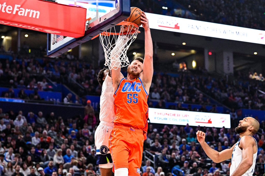 Oklahoma City Thunder center/forward Isaiah Hartenstein (55) attempts to dunk against Minnesota Timberwolves during the first half of an Emirates NBA Cup basketball game, Wednesday, Nov. 26, 2025, in Oklahoma City. (AP Photo/Gerald Leong)
