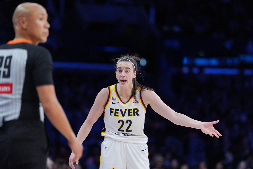 Indiana Fever guard Caitlin Clark (22) reacts to a call during the first half of a WNBA basketball game against the Los Angeles Sparks Wednesday, May 13, 2026, in Los Angeles. (AP Photo/Jae C. Hong)