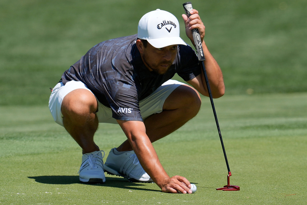 Xander Schaufele lines up a putt on the 11th green during a practice round of the RBC Heritage golf tournament on Hilton Head Island, S.C, Wednesday, April 15, 2026, in Hilton Head Island,, S.C. (AP Photo/Mike Stewart)