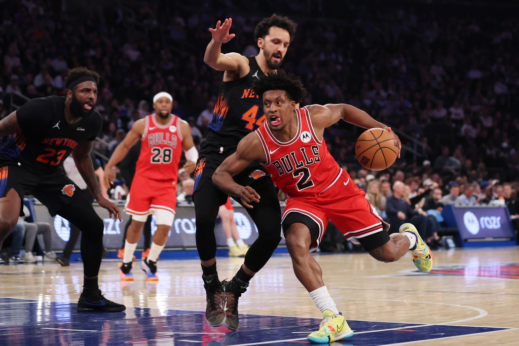 Chicago Bulls guard Collin Sexton (2) drives to the basket past New York Knicks guard Landry Shamet during the first half of an NBA basketball game, Friday, April 3, 2026, in New York. (AP Photo/Heather Khalifa)