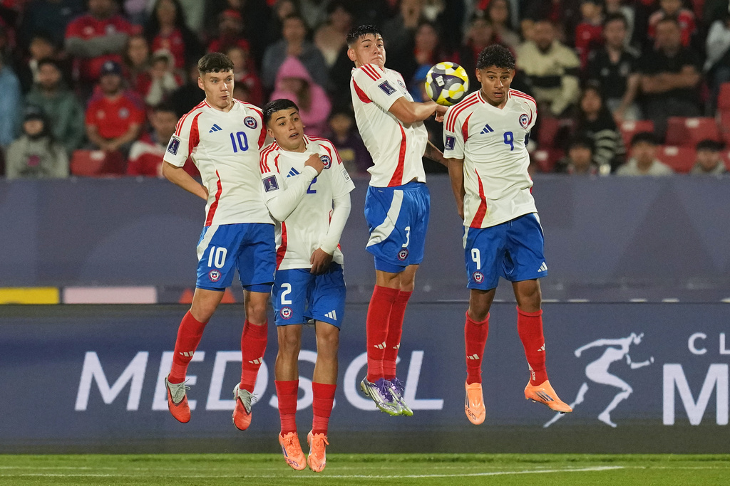 FILE - Chile's players go up to block a free kick against Egypt during a FIFA U-20 World Cup Group A soccer match at National Stadium in Santiago, Chile, Friday, Oct. 3, 2025. (AP Photo/Esteban Felix, File)