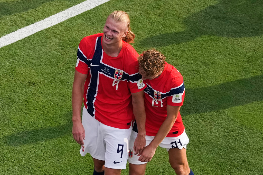 Norway's Erling Haaland (9) and Andreas Schjelderup (21) celebrate after Haaland scored their second goal during the World Cup round of 16 soccer match between Brazil and Norway in East Rutherford, N.J., near New York, Sunday, July 5, 2026. (AP Photo/Matt Slocum)