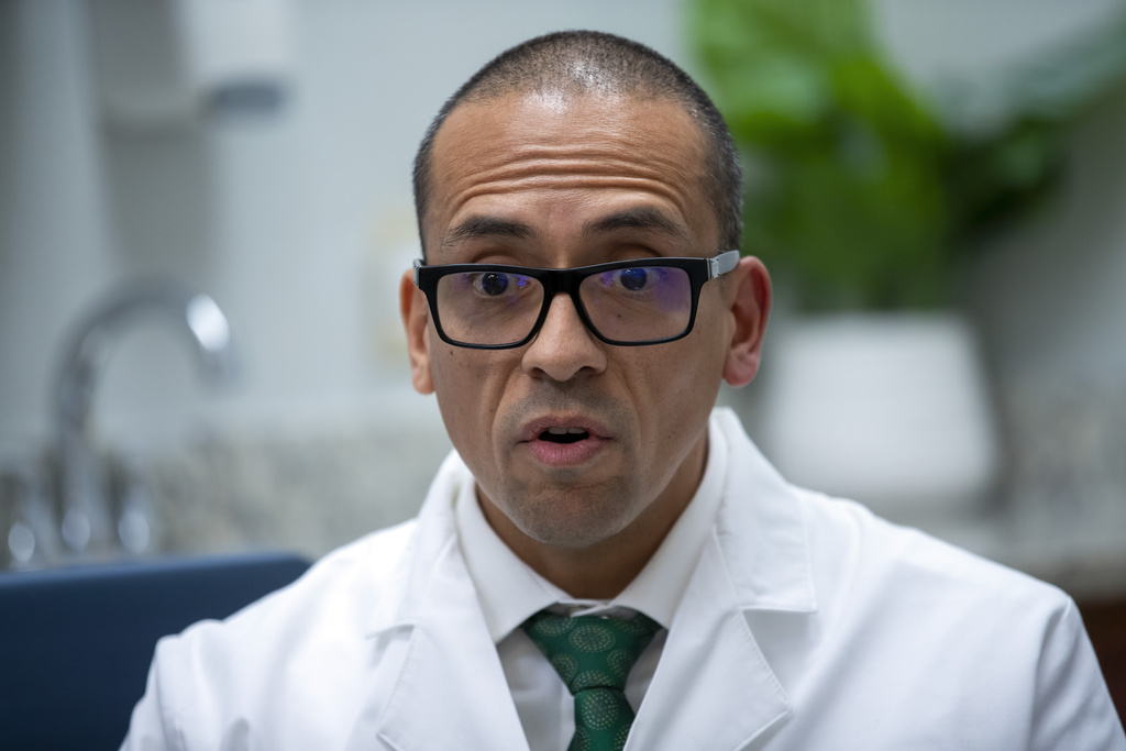 FILE - Pediatric endocrinologist Dr. Hector Granados speaks during an interview at his private practice in El Paso, Texas, Jan. 21, 2025. (AP Photo/Andres Leighton, File)