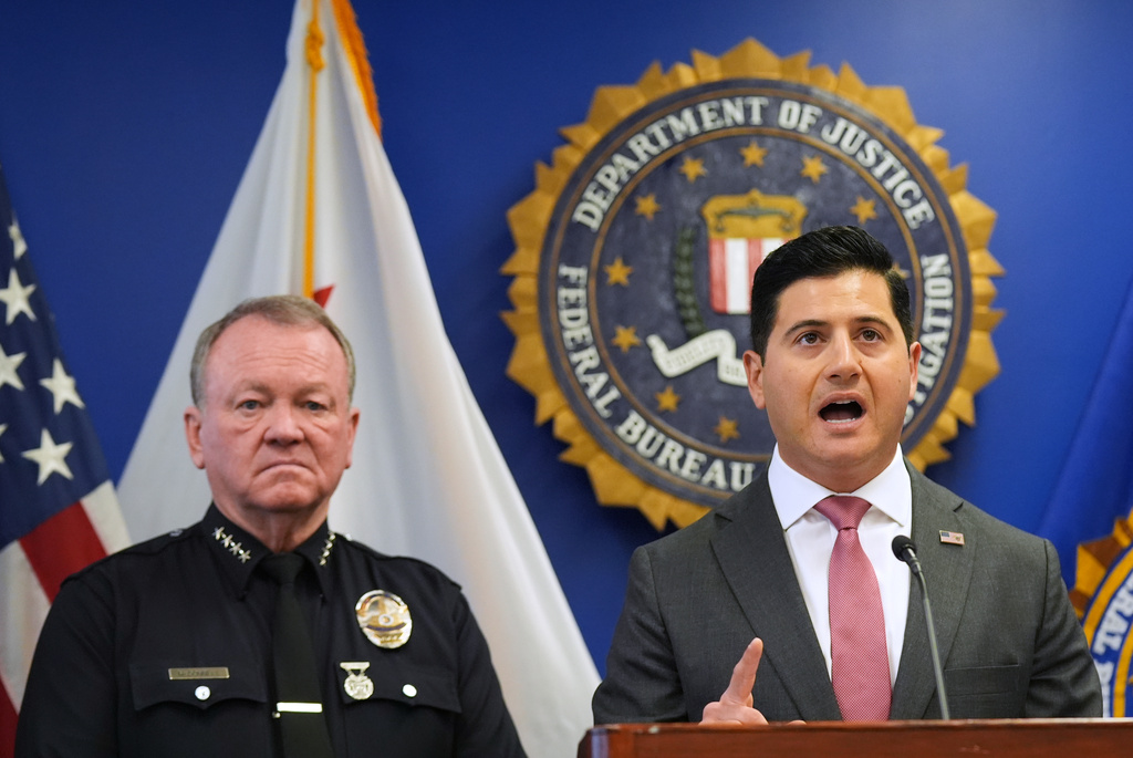 First Assistant United States Attorney Bill Essayli, right, speaks in front of LAPD Chief Jim McDonnell during a press conference announcing developments on a terrorism investigation Monday, Dec. 15, 2025, in Los Angeles. (AP Photo/Damian Dovarganes)