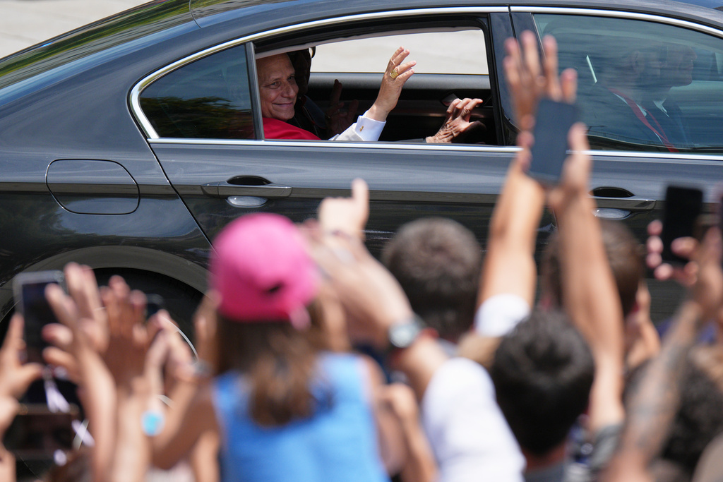 Pope Leo XIV waves to the cheering crowd upon arriving to attend a midday prayer at the Cathedral of the Holy Cross and Saint Eulalia in Barcelona, Spain, Tuesday, June 9, 2026. (AP Photo/Emilio Morenatti)