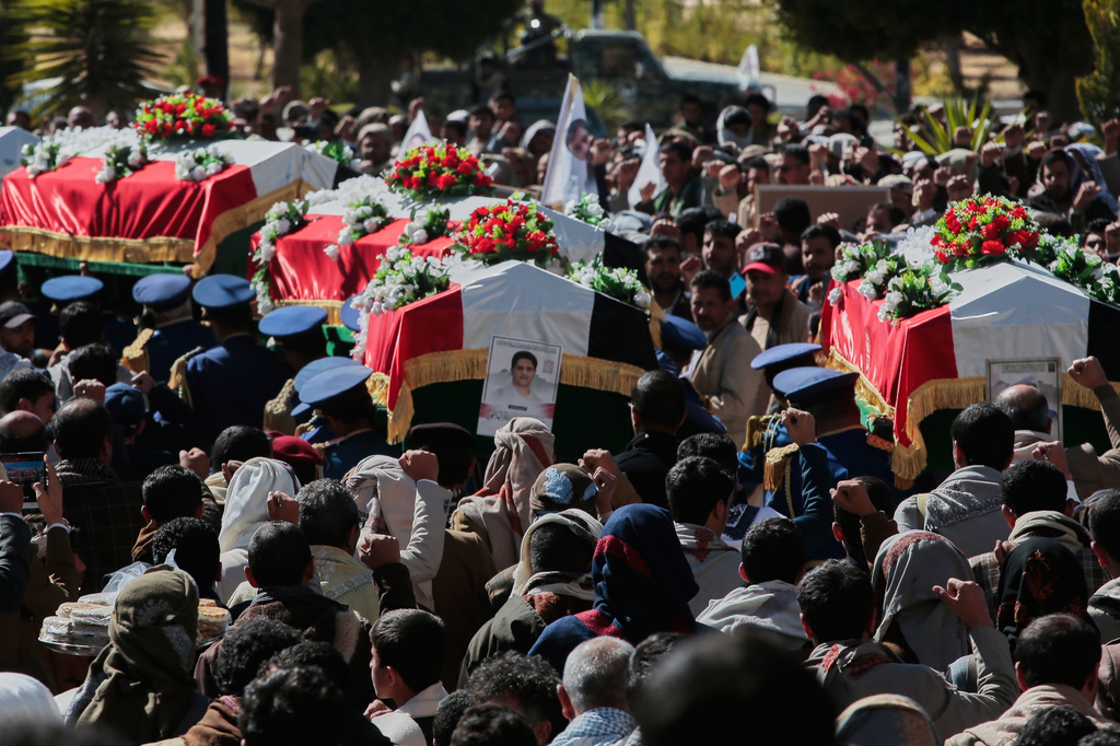 Houthi supporters carry the coffins of 5 leaders, who they said were killed during previous Israeli airstrikes, during a funeral at the people's mosque in Sanaa, Yemen, Thursday, Dec. 25, 2025. (AP Photo/Osamah Abdulrahman)