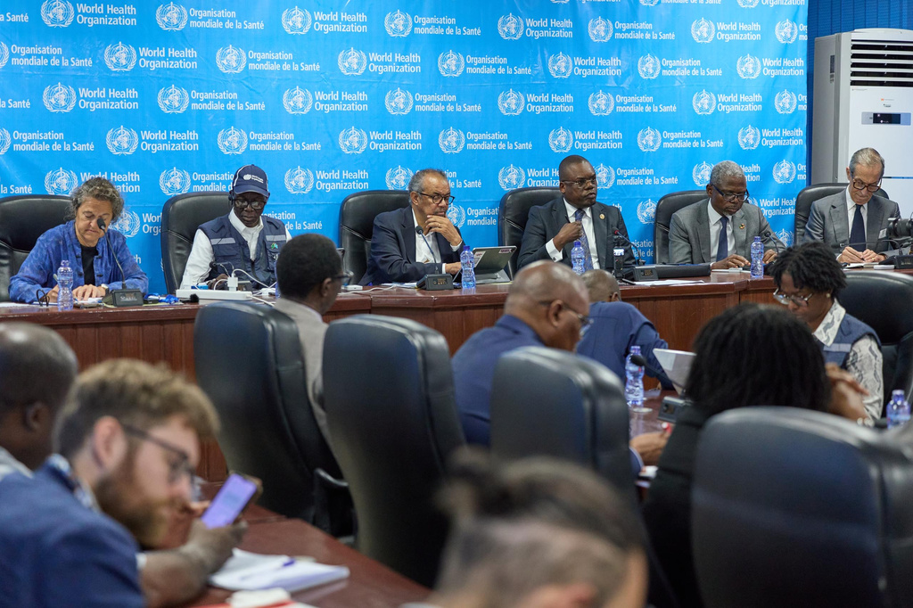 In this photo released by the World Health Organization (WHO), Tedros Adhanom Ghebreyesus, WHO Director General, centre, attends a meeting with partners in Kinshasa, Congo, Wednesday, Aug 5, 2026. (World Health Organization Via AP)