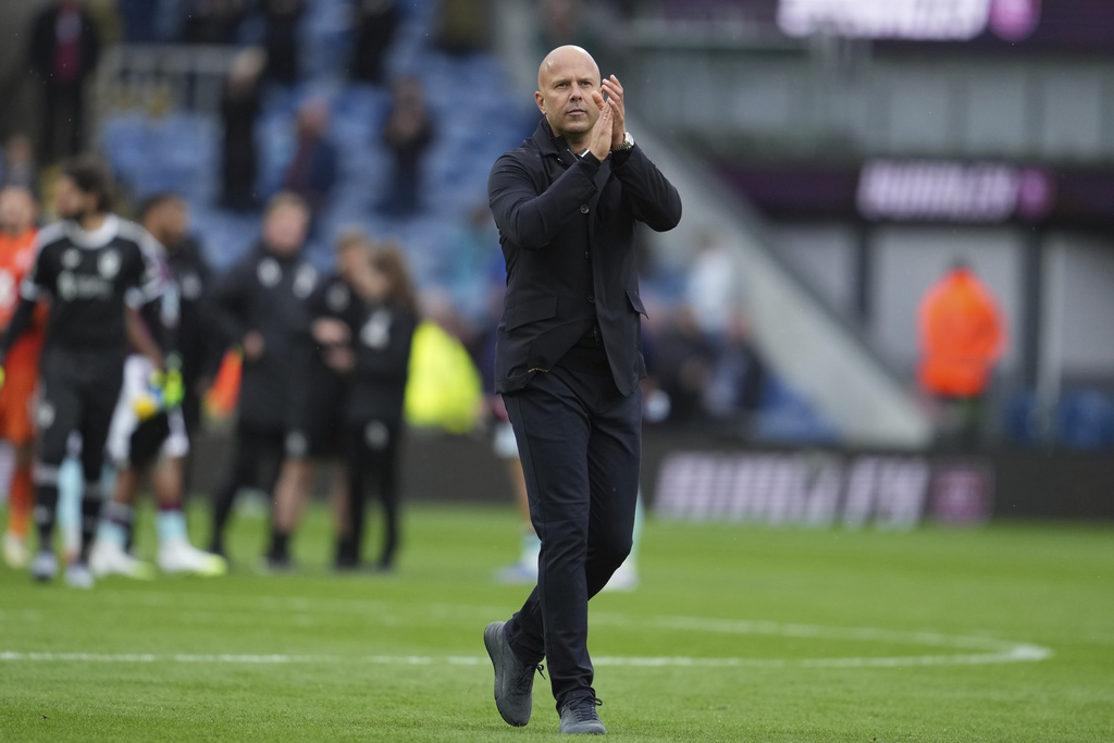 Liverpool's manager Arne Slot walks off the pitch after the Premier League soccer match between Burnley and Liverpool in Burnley, England, Sunday, Sept. 14, 2025. (AP Photo/Jon Super)