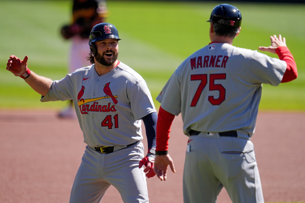 St. Louis Cardinals' Alec Burleson (41) celebrates with third base coach Ron 'pop' Warner (75) as he rounds third base after hitting a solo home run off Pittsburgh Pirates pitcher Paul Skenes during the first inning of a baseball game in Pittsburgh, Thursday, Sept. 24, 2026. (AP Photo/Gene J. Puskar)