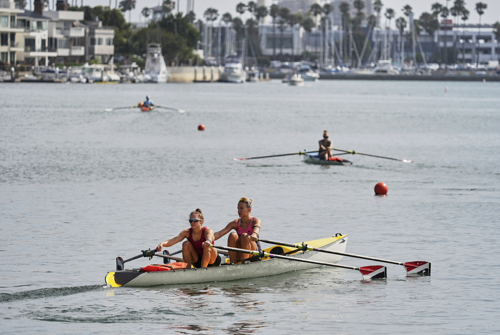 Athletes train at a beach sprints camp organized by USRowing in Long Beach, Calif., Sunday, Aug. 10, 2025. (AP Photo/Damian Dovarganes)