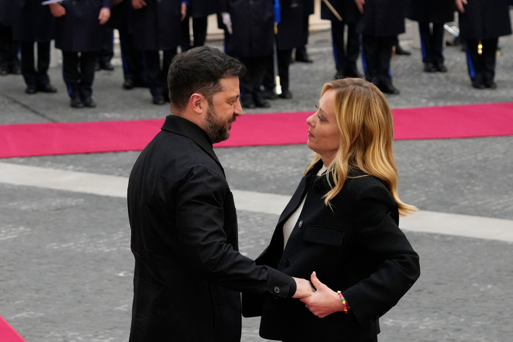 Ukraine's President Volodymyr Zelenskyy, left, is received at Chigi Palace by Italian Premier Giorgia Meloni, Tuesday, Dec. 9, 2025. (AP Photo/Gregorio Borgia)
