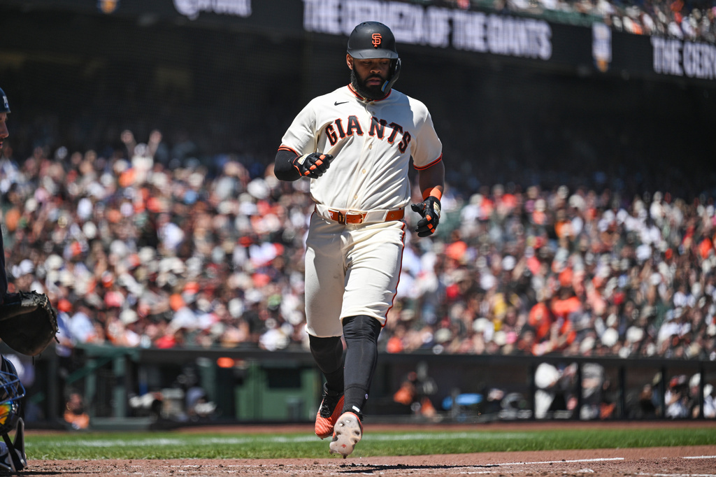 San Francisco Giants' Heliot Ramos scores in the sixth inning of a baseball game against the Atlanta Braves, Sunday, June 28, 2026, in San Francisco (AP Photo/Justine Willard)