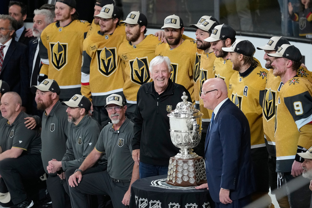 Vegas Golden Knights owner Bill Foley, middle, celebrate after winning Game 4 of the Western Conference finals NHL hockey Stanley Cup playoff series against the Colorado Avalanche Tuesday, May 26, 2026, in Las Vegas. (AP Photo/John Locher)