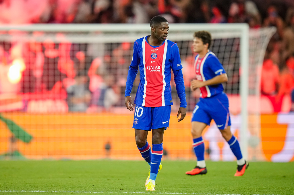 PSG's Ousmane Dembele reacts after PSG's Desire Doue scored his side's second goal during the UEFA Super Cup soccer match between Paris Saint-Germain and Aston Villa in Salzburg, Austria, Wednesday, Aug.12, 2026. (AP Photo/Darko Bandic)