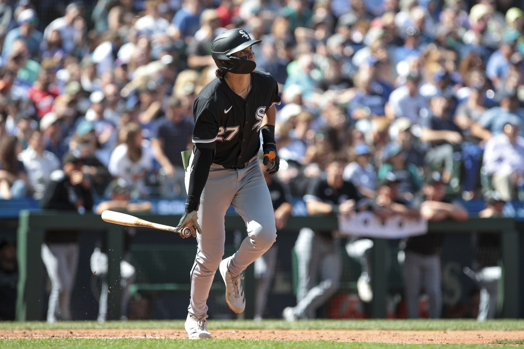 Chicago White Sox's Brooks Baldwin watches his home run off Seattle Mariners pitcher Carlos Vargas during the seventh inning of a baseball game, Thursday, Aug. 7, 2025, in Seattle. (AP Photo/Jason Redmond)