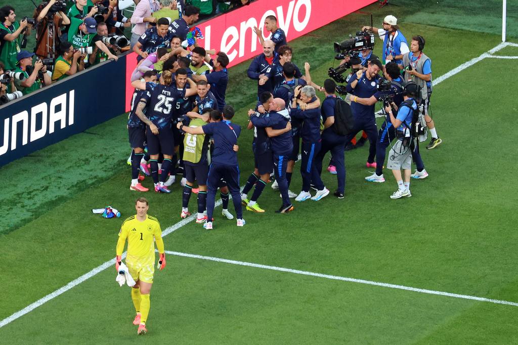 Germany goalkeeper Manuel Neuer (1) reacts as Paraguay players celebrate after a penalty shootout at the end of the World Cup round of 32 soccer match between Germany and Paraguay in Foxborough, Mass., near Boston, Monday, June 29, 2026. (AP Photo/Mark Stockwell)