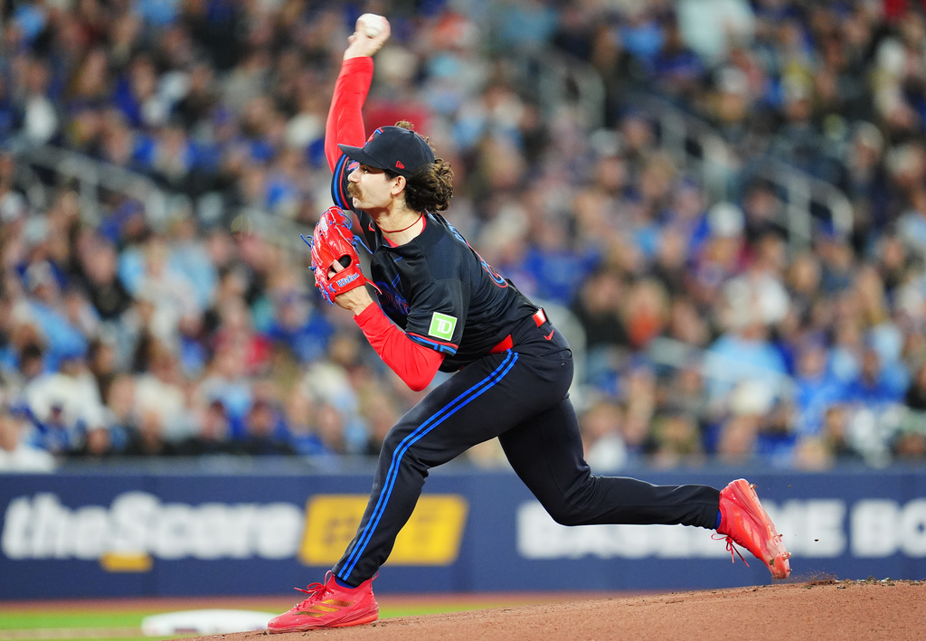 Toronto Blue Jays pitcher Dylan Cease (84) works against the Los Angeles Angels during the first inning of a baseball game in Toronto, Friday, May 8, 2026. (Frank Gunn/The Canadian Press via AP)