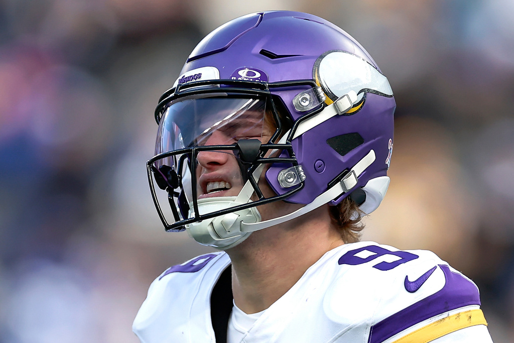 Minnesota Vikings quarterback J.J. McCarthy (9) reacts during the second quarter of an NFL football game against the New York Giants, Sunday, Dec. 21, 2025, in East Rutherford, N.J. (AP Photo/Adam Hunger)