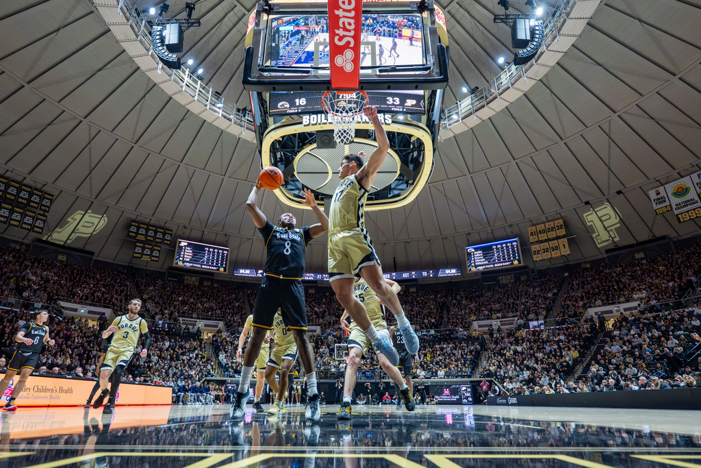 Kent State guard Morgan Safford (8) shoots while being defended by Purdue guard Omer Mayer (17) during the first half of an NCAA college basketball game, Monday, Dec. 29, 2025, in West Lafayette, Ind. (AP Photo/Doug McSchooler)