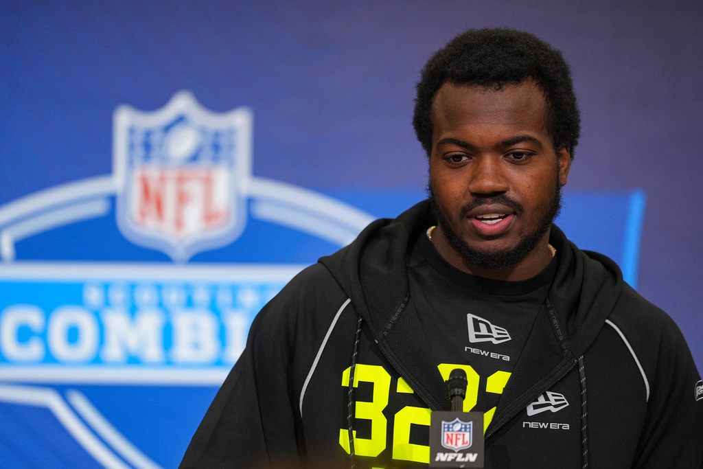 Miami defensive lineman Rueben Bain Jr. (32) speaks during a press conference at the NFL football scouting combine in Indianapolis, Wednesday, Feb. 25, 2026. (AP Photo/Michael Conroy)
