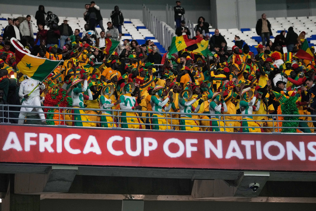 Senegal supportes cheer during the Africa Cup of Nations group D soccer match between Benin and Senegal in Tangier, Morocco, Tuesday, Dec. 30, 2025. (AP Photo/Themba Hadebe)