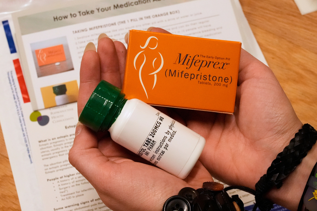 FILE - A coordinator shows the medications and care kit sent out the clients at the Massachusetts Medication Abortion Access Project, May 13, 2025, in Somerville, Mass. (AP Photo/Charles Krupa, File)