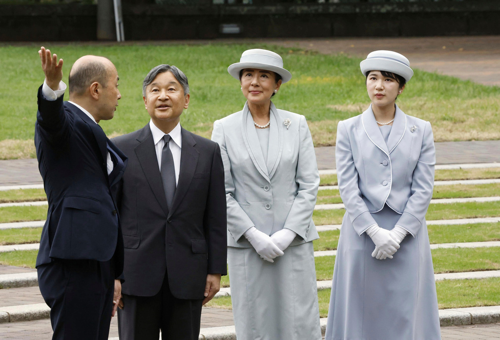 FILE - Japanese Emperor Naruhito, center left, Empress Masako center right, and Princess Aiko, right, listen to Nagasaki Mayor Shiro Suzuki as they visit the cenotaph for the atomic bombing victims at the peace park in Nagasaki. western Japan, Sept. 12, 2025. (Kyodo News via AP, File)