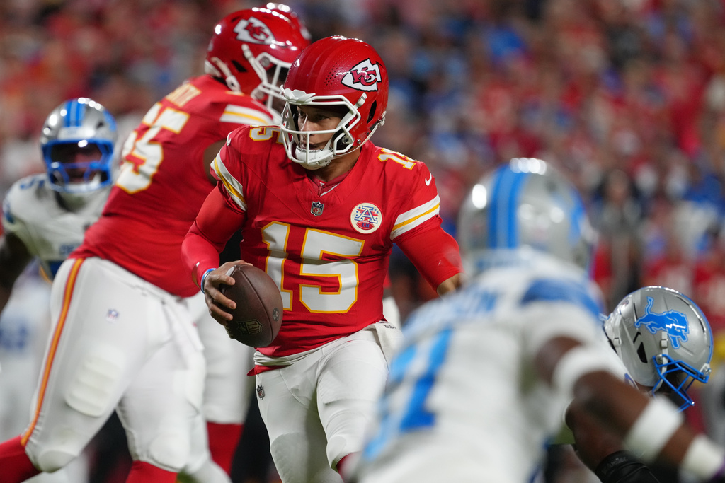 Kansas City Chiefs quarterback Patrick Mahomes (15) scrambles during the first half of an NFL football game against the Detroit Lions Sunday, Oct. 12, 2025, in Kansas City, Mo. (AP Photo/Ed Zurga)