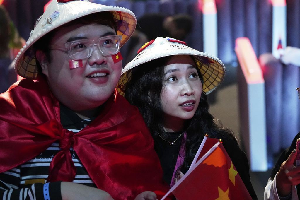 Fans of Vietnam's Duc Phuc watch his performance at the International Music Competition "Intervision" at the Live Arena outside Moscow, Russia, Saturday, Sept. 20, 2025. (AP Photo/Alexander Zemlianichenko)