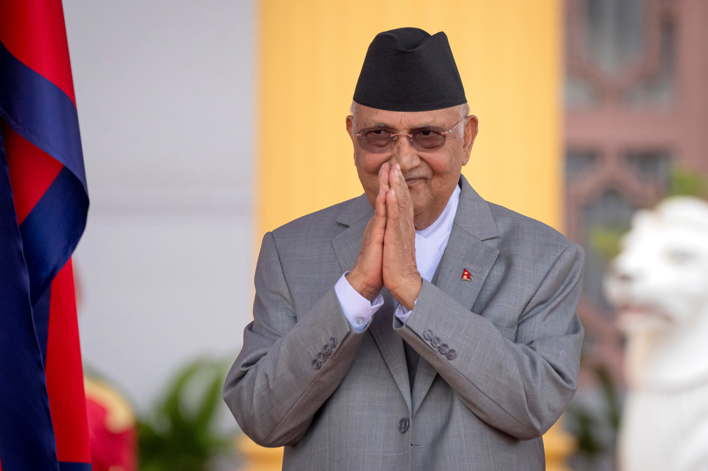 FILE -The then newly elected Prime Minister Khadga Prasad Oli greets after the oath of office in President residence in Kathmandu, Nepal, July 15, 2024. (AP Photo/Niranjan Shrestha, File)