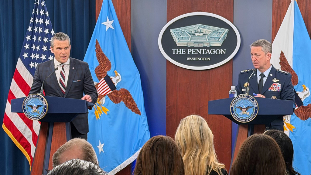 Defense Secretary Pete Hegseth and Chairman of the Joint Chiefs of Staff Gen. Dan Caine, speak during a press briefing at the Pentagon, Wednesday, March 4, 2026, in Washington. (AP Photo/Konstantin Toropin)