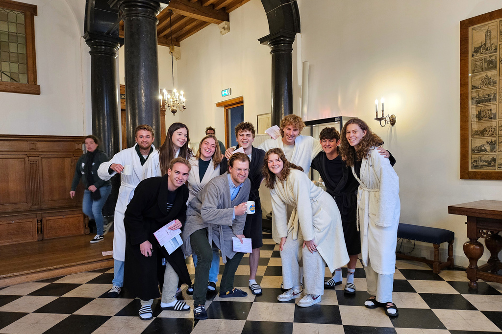 Students in pajamas prepare to vote at a polling station during the Dutch elections in Delft, Netherlands, Wednesday, Oct. 29, 2025. (AP Photo/Molly Quell)