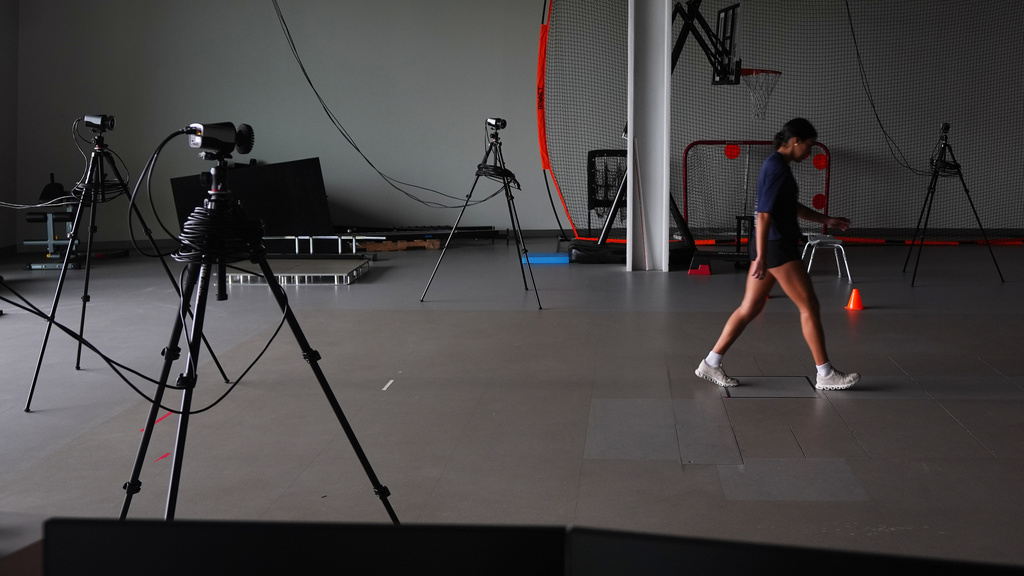 Cameras analyze Plano East High School soccer player Sofia Tepichian, right, as she walks at the Movement Science Laboratory at Scottish Rite for Children in Frisco, Texas, Jan. 22, 2026. (AP Photo/LM Otero)