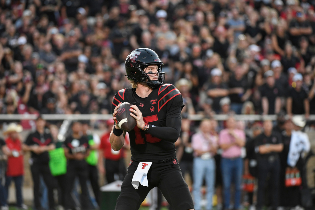 Texas Tech quarterback Will Hammond drops back to throw the ball against Houston during the first half of an NCAA college football game Friday, Sept. 18, 2026, in Lubbock, Texas. (AP Photo/Justin Rex)