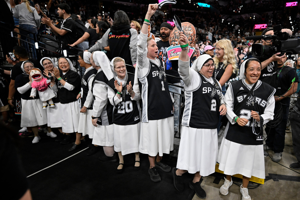 Nuns cheer before the first half of Game 6 in the Western Conference finals NBA basketball playoffs series between the San Antonio Spurs and the Oklahoma City Thunder, Thursday, May 28, 2026, in San Antonio. (AP Photo/Darren Abate)
