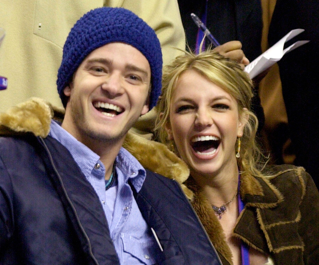 FILE - Justin Timberlake, left, and Britney Spears appear at the 2002 NBA All-Star game, in Philadelphia, Feb. 10, 2002. (AP Photo/Chris Gardner, File)