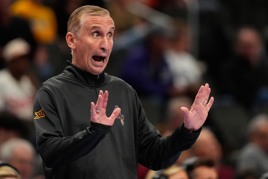 Arizona State head coach Bobby Hurley motions to his players during the first half of an NCAA college basketball game against Baylor at the Big 12 Conference tournament Tuesday, March 10, 2026, in Kansas City, Mo. (AP Photo/Charlie Riedel)