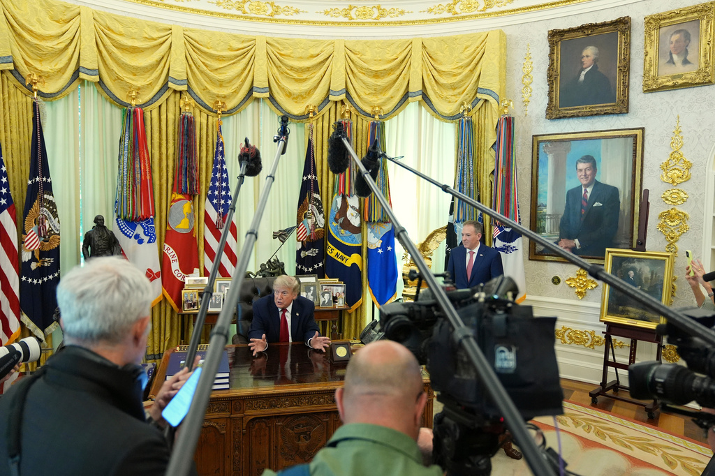 President Donald Trump speaks to reporters as Environmental Protection Agency administrator Lee Zeldin listens in the Oval Office of the White House, Monday, June 29, 2026, in Washington. (AP Photo/Jacquelyn Martin)