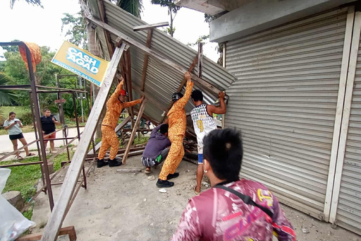 In this photo provided by the Bureau of Fire Protection, firefighters and residents hold on a toppled structure following a strong earthquake in Davao Oriental province, southern Philippines on Friday Oct. 10, 2025. (Bureau of Fire Protection via AP) In this photo provided by the Bureau of Fire Protection, firefighters and residents hold on a toppled structure following a strong earthquake in Davao Oriental province, southern Philippines on Friday Oct. 10, 2025. (Bureau of Fire Protection via AP)