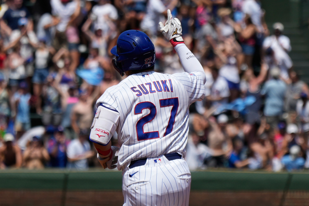 Chicago Cubs' Seiya Suzuki, left, of Japan, celebrates as he rounds the bases after hitting a three-run home run during the first inning of a baseball game against the San Diego Padres in Chicago, Wednesday, July 1, 2026. (AP Photo/Nam Y. Huh)