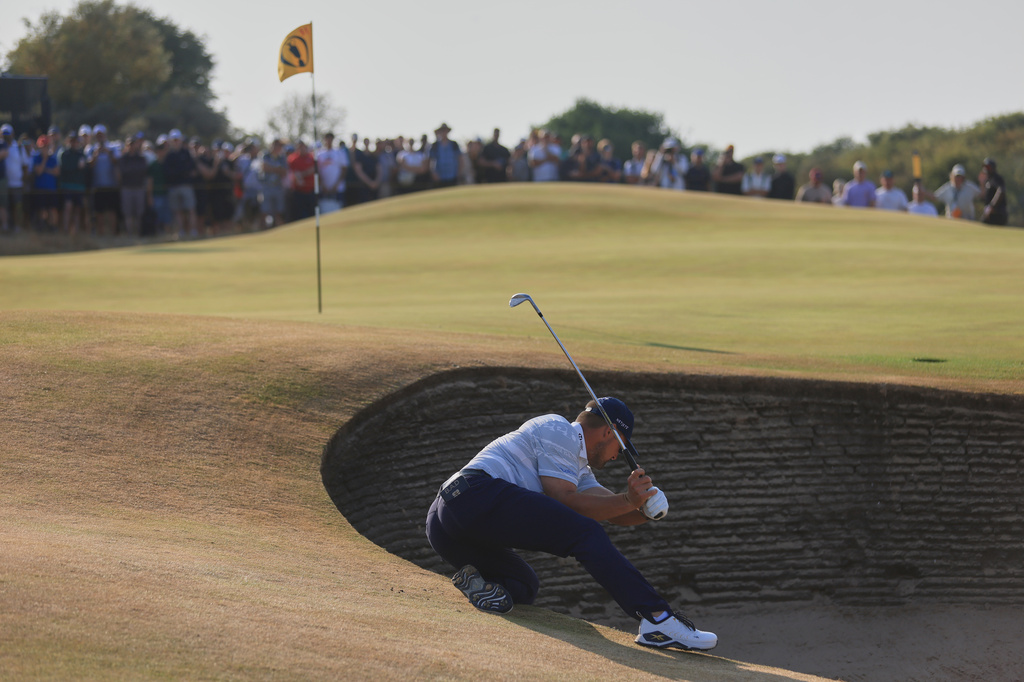 Bryson DeChambeau of the United States plays out of a bunker on the 14th green during the third day of the British Open Golf championships at Royal Birkdale golf club, in Southport, England, Saturday, July 18, 2026. (AP Photo/Peter Morrison)
