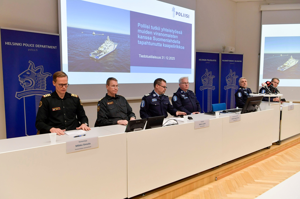 From left, Gulf of Finland Coast Guard District Commander Mikko Simola, Chief of the Border Guard Markku Hassinen, Director of the National Bureau of Investigation Robin Lardot, Helsinki Deputy Police Commissioner Heikki Kopperoinen, Helsinki Police Department chief Jari Liukku and National Police Comissioner Ilkka Koskimaeki, attend a press conferance in Helsinki, Finland, Wednesday, Dec. 31, 2025. (Kimmo Penttinen/Lehtikuva via AP)