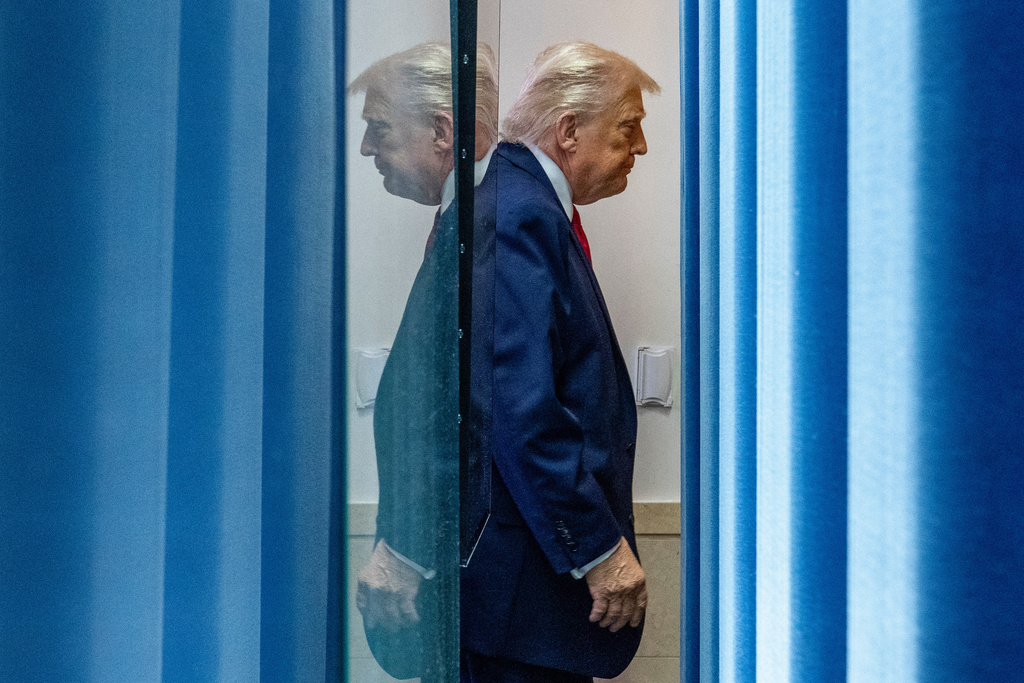 President Donald Trump departs after speaking with reporters in the James Brady Press Briefing Room at the White House, Tuesday, Jan. 20, 2026, in Washington. (AP Photo/Alex Brandon)