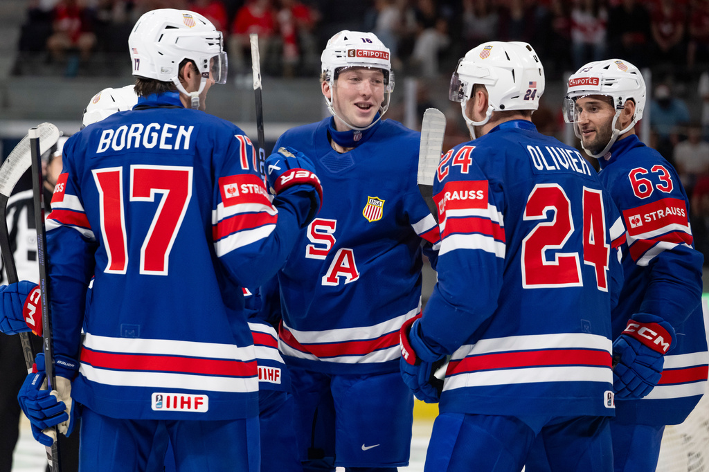 USA's players celebrate their side's third goal during the 2026 IIHF Men's Ice Hockey World Championship preliminary round group A match between United States and Austria in Zurich, Switzerland, Tuesday, May 26, 2026. (Andreas Becker/Keystone via AP)
