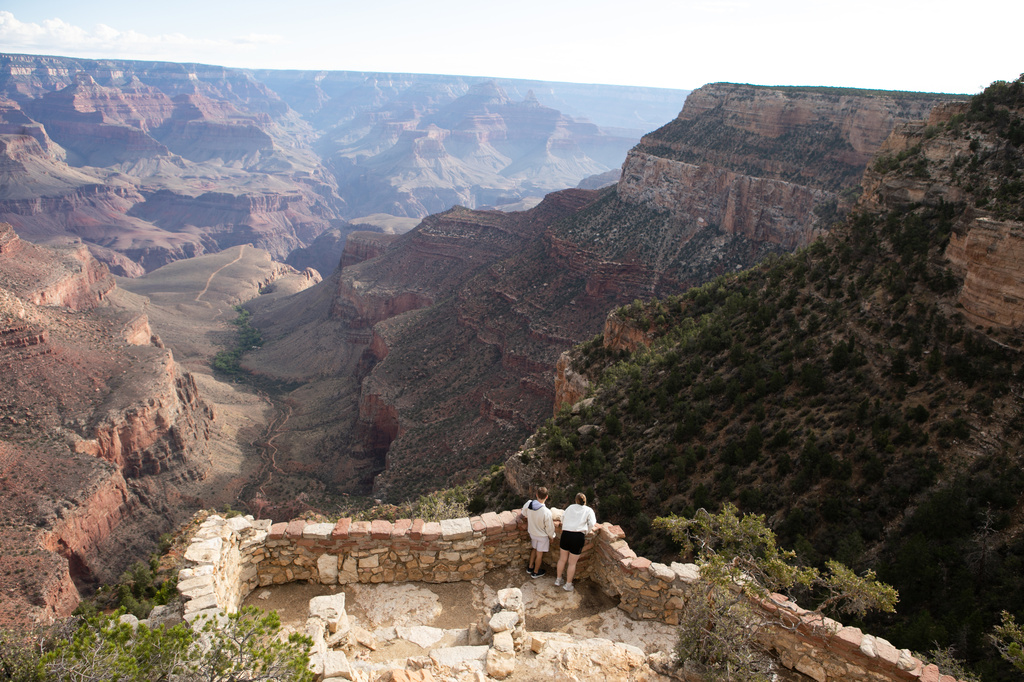Tourists look down into the Grand Canyon off of the south rim, Monday, Aug. 31, 2026 at Grand Canyon National Park, Ariz. (AP Photo/Josh Biggs)