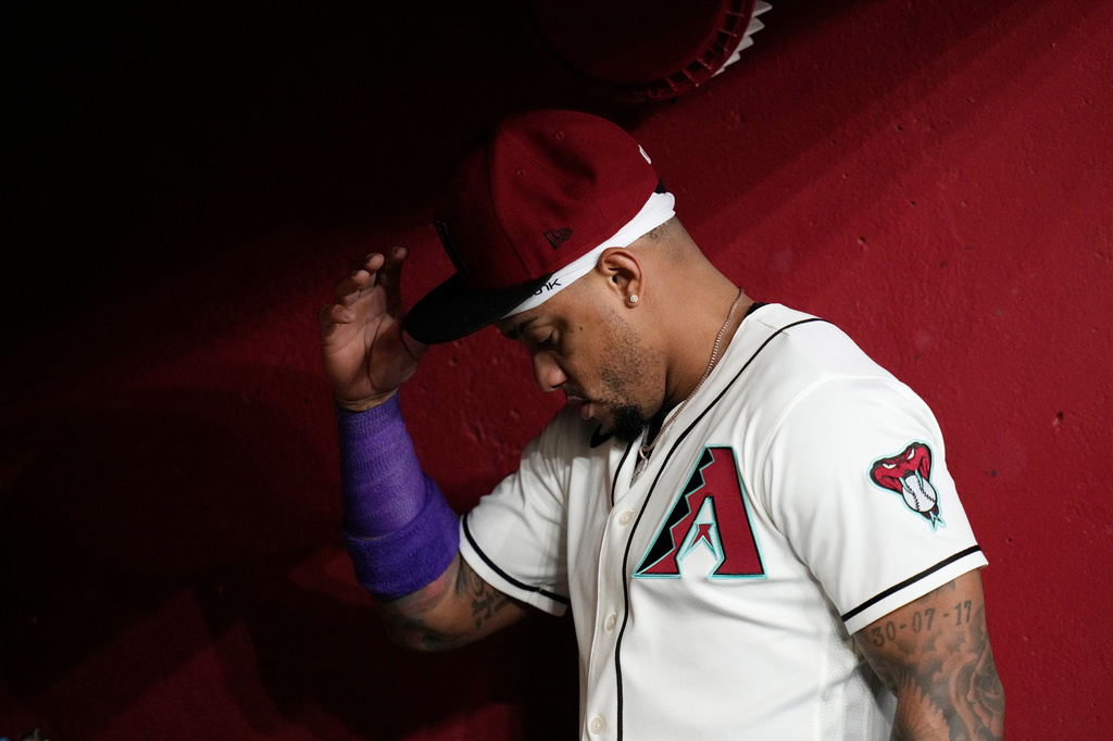Arizona Diamondbacks' Ketel Marte pauses in the dugout prior to a baseball game against the Philadelphia Phillies, Monday, Aug. 31, 2026, in Phoenix. (AP Photo/Ross D. Franklin)