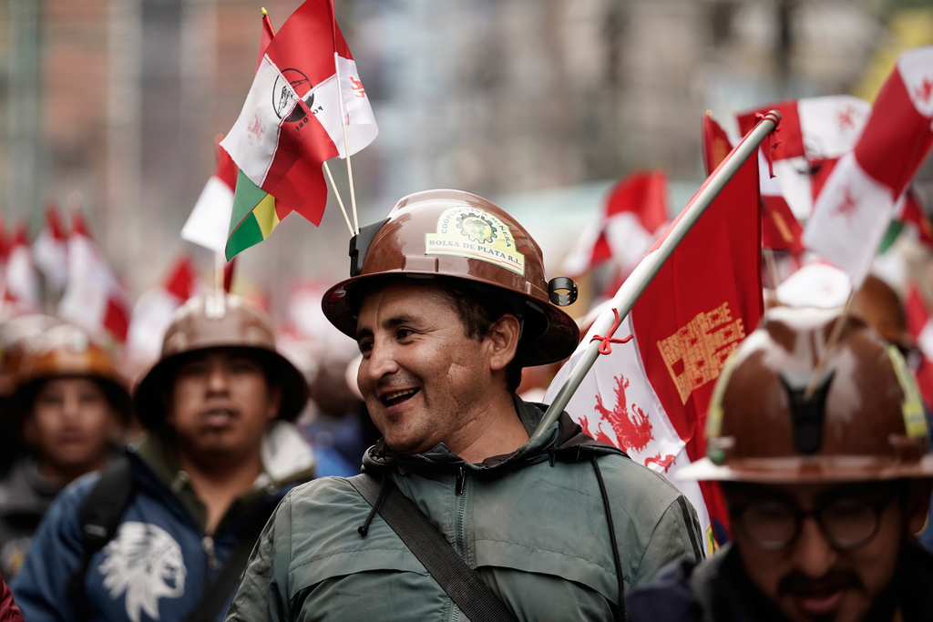 Miners march to protest President Rodrigo Paz's decision to remove fuel subsidies in La Paz, Bolivia Monday, Dec. 22, 2025. (AP Photo/Freddy Barragan)