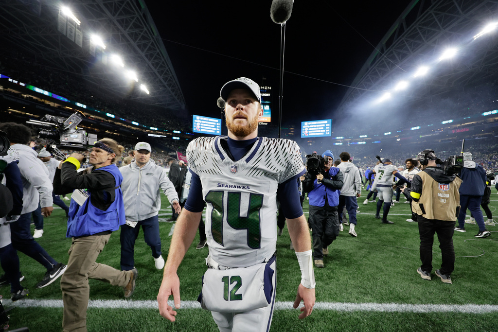 Seattle Seahawks quarterback Sam Darnold (14) walks on the field after an NFL football game against the Los Angeles Rams, Thursday, Dec. 18, 2025, in Seattle. (AP Photo/John Froschauer)